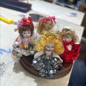 Vintage Porcelain Doll Set with Colorful Dresses dolls